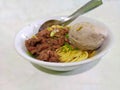 A bowl of chicken noodles plus meatballs, plus sliced Ã¢â¬â¹Ã¢â¬â¹scallions, ready to eat Royalty Free Stock Photo